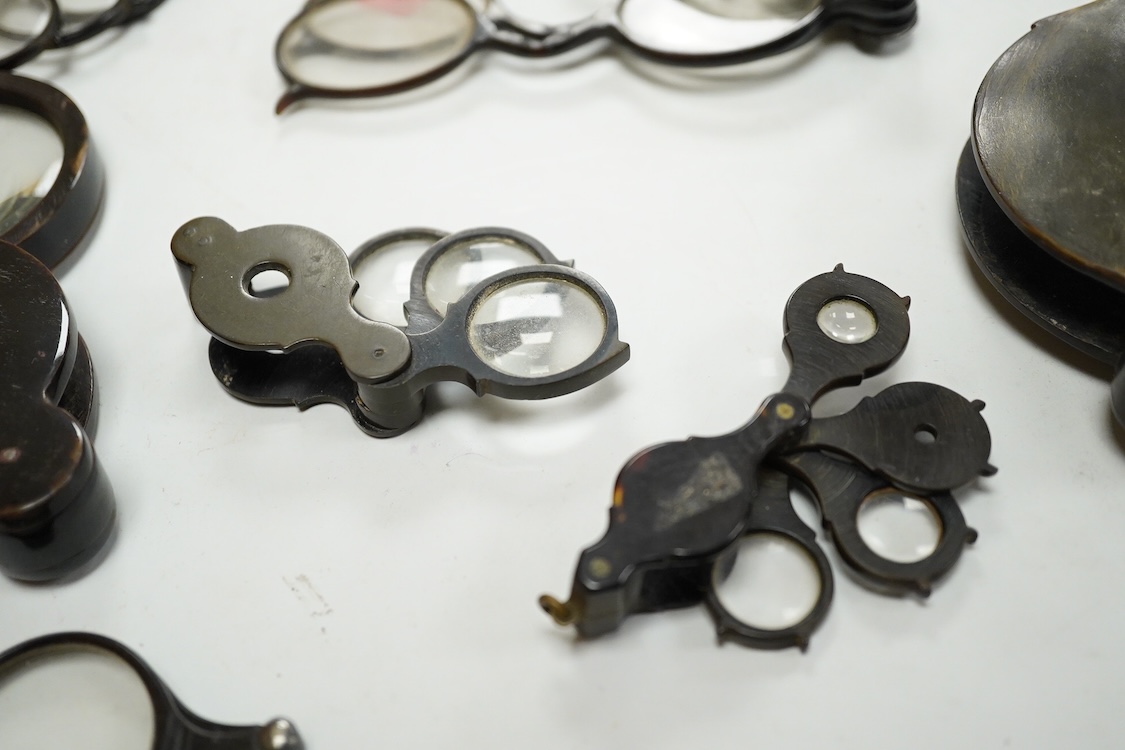A group of 19th-century horn framed loupes, quizzing glasses and four optician multiple lens sizing lorgnettes (13)
